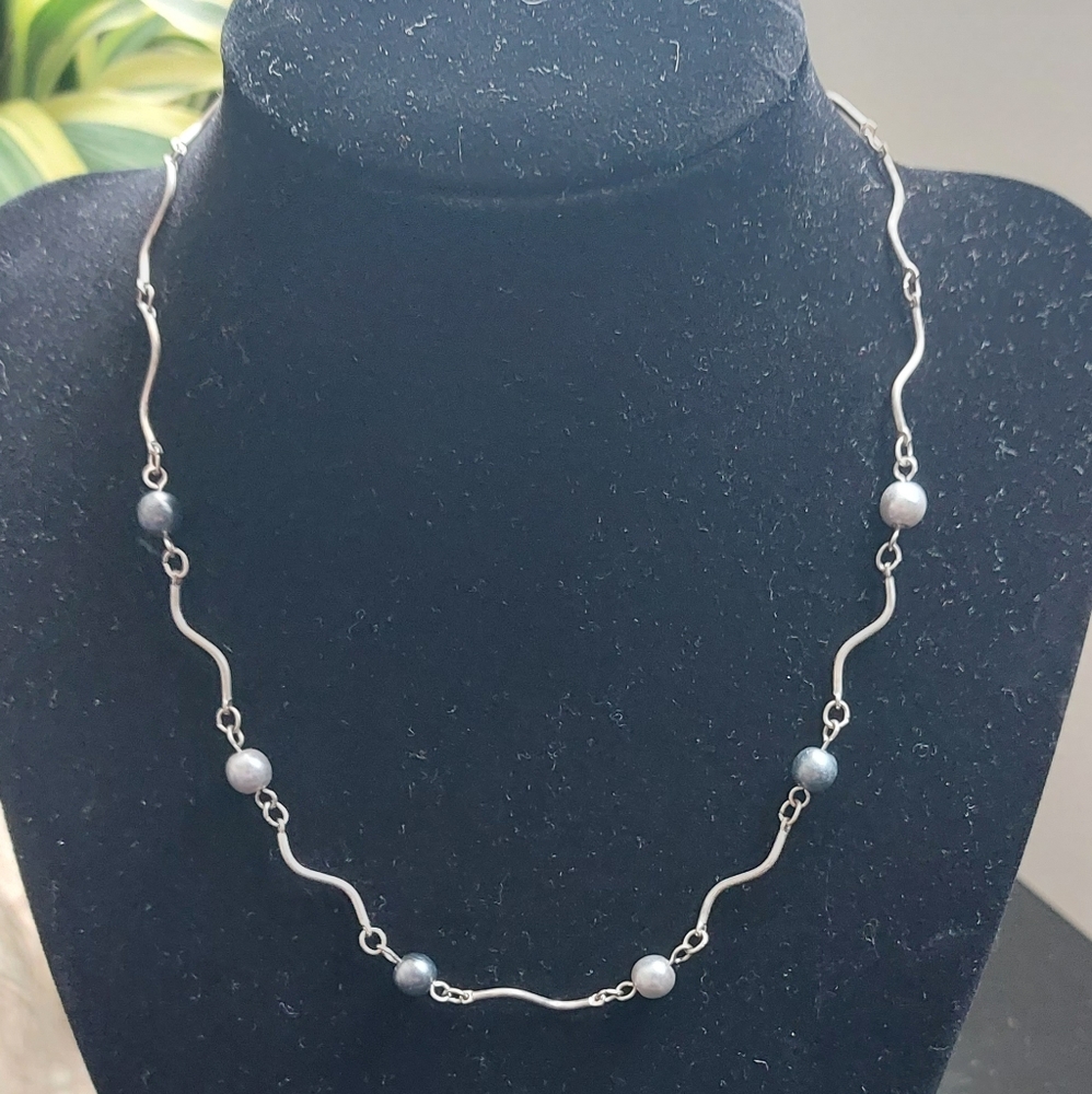 Silver necklace with gray pearls